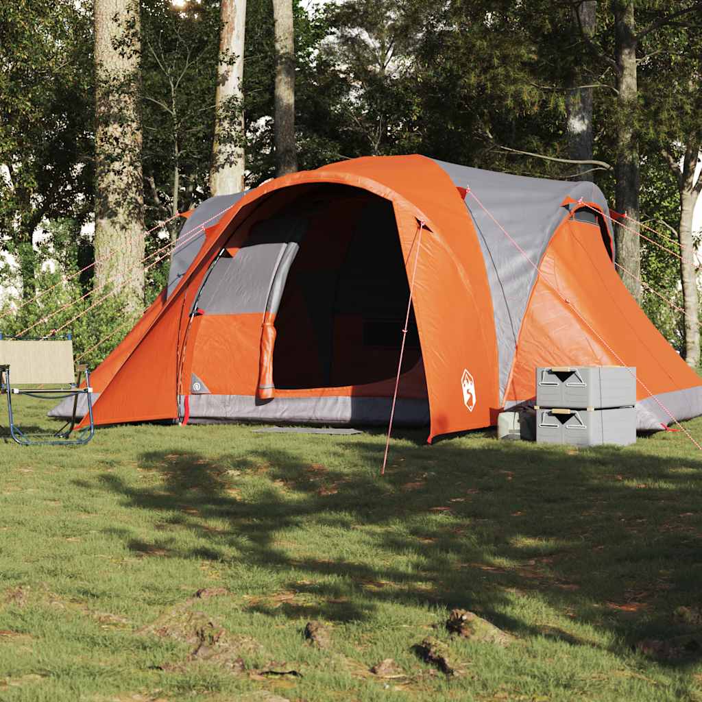 Zijaanzicht van de vidaXL koepeltent in grijs en oranje, opgesteld in een bosrijke omgeving.