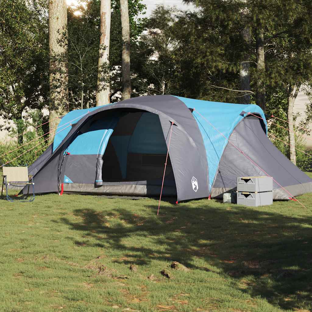 Zijaanzicht van de vidaXL koepeltent in blauw en grijs, opgesteld in een groene omgeving.