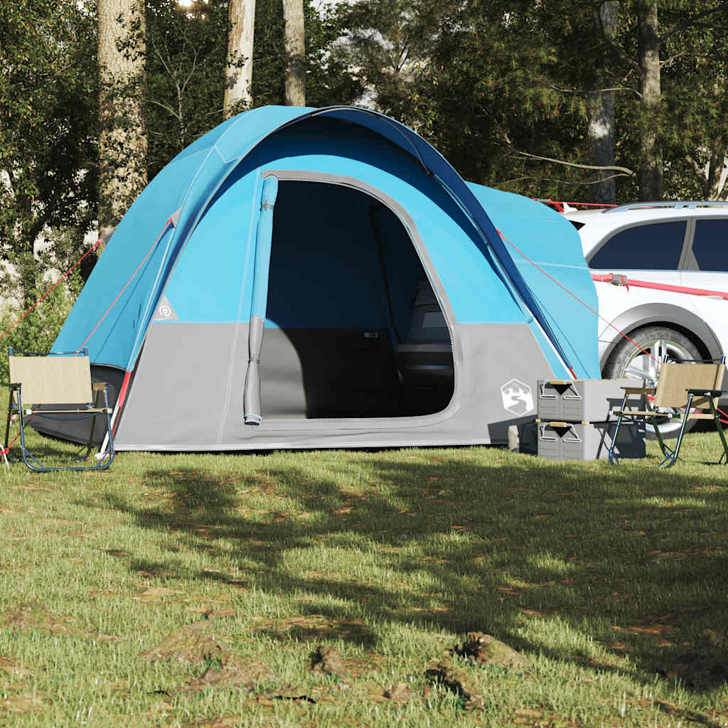Detail van de vidaXL autotent in blauw met open ingang en campingstoelen ernaast.