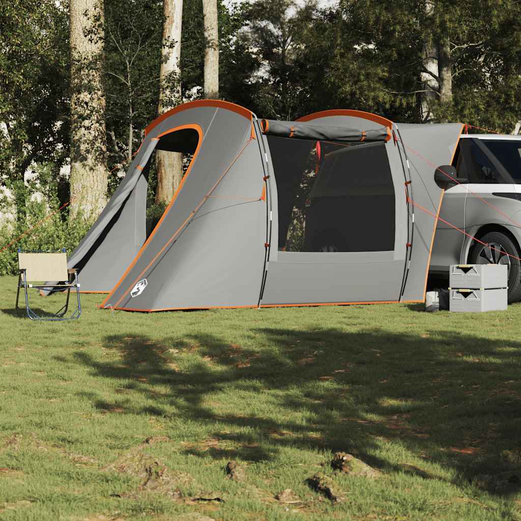 Detail van de vidaXL autotent in grijs en oranje, met open ingang en zicht op de omgeving.