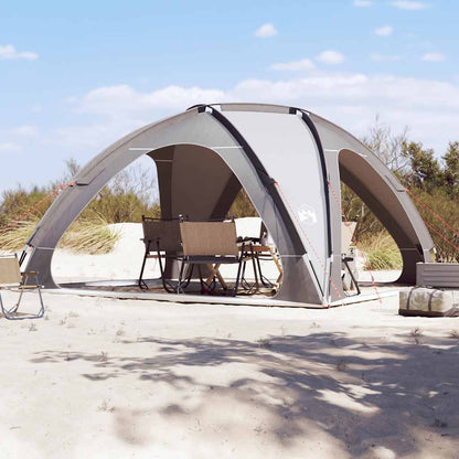 Zijaanzicht van de vidaXL waterdichte partytent in grijs, opgezet op een zandstrand.