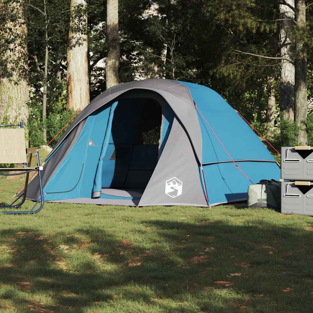 Zijaanzicht van de vidaXL 4-persoons tent in blauw met grijze accenten, geplaatst op gras.