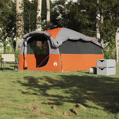Zijaanzicht van de vidaXL tunneltent in grijs en oranje, opgesteld in de natuur.