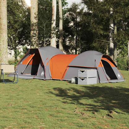 Zijaanzicht van de vidaXL 5-persoons tent in grijs en oranje, geplaatst op gras.
