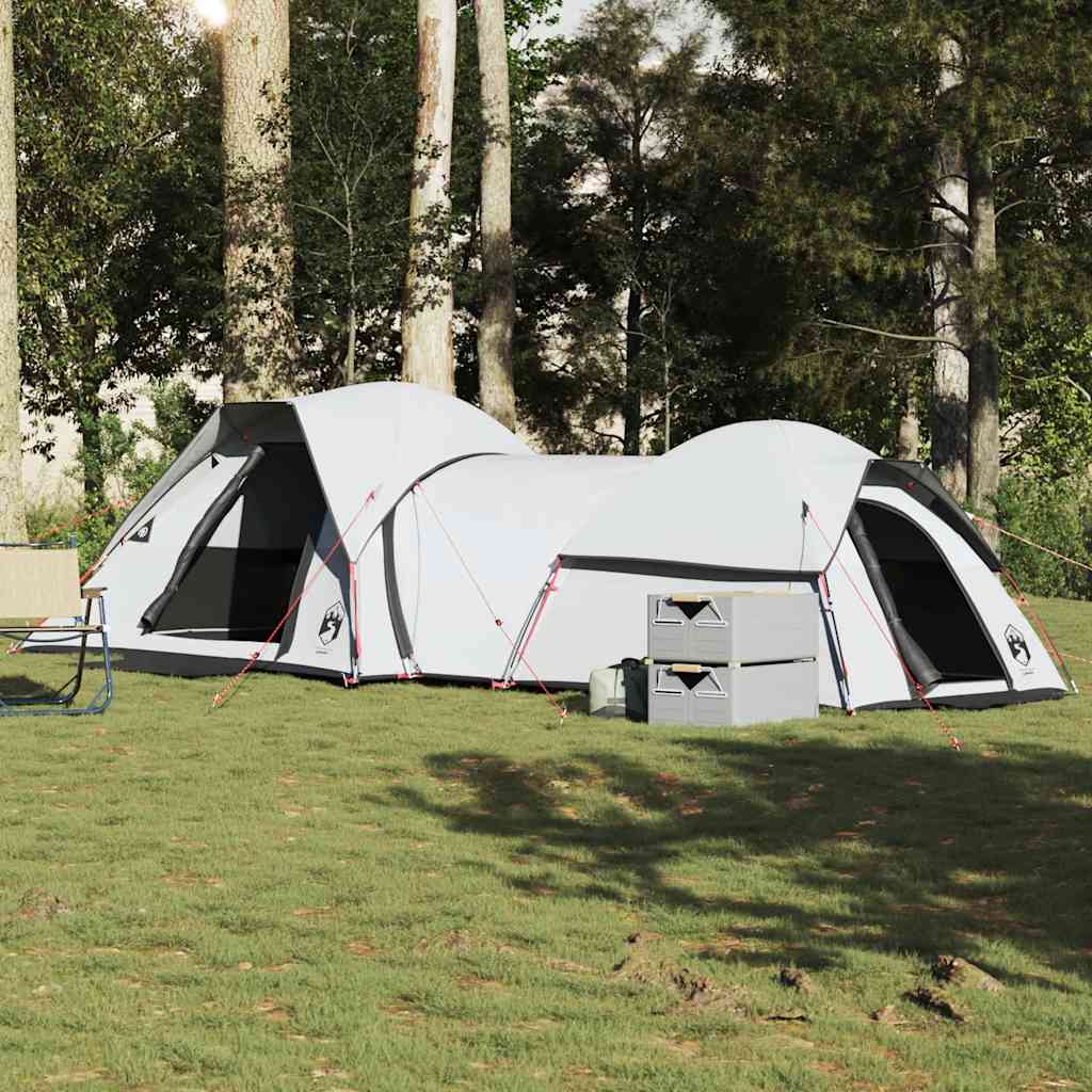 VidaXL 5-persoons verduisterende tent in wit, opgesteld op gras tussen bomen.