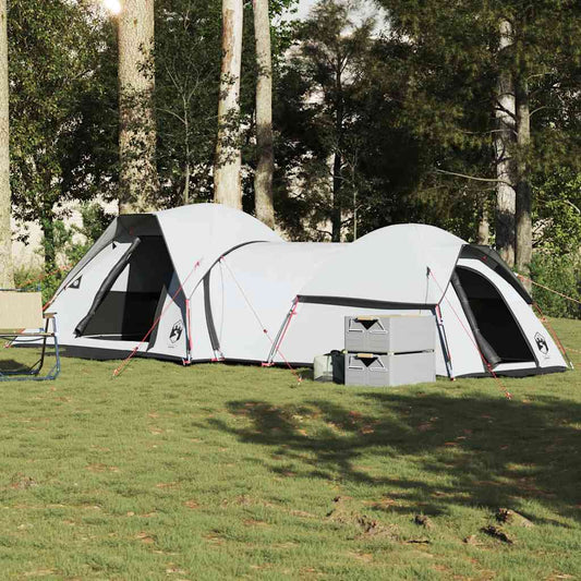 VidaXL 5-persoons verduisterende tent in wit, opgesteld op gras tussen bomen.