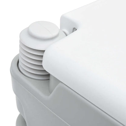 Detail van de bellows-pomp van het vidaXL Camping Toilet in grijs en wit.