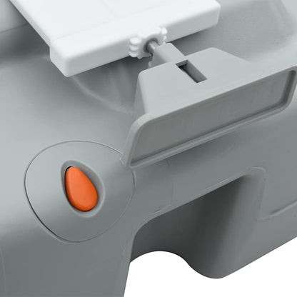 Detail van de oranje knop en het handvat van het vidaXL Camping Toilet.