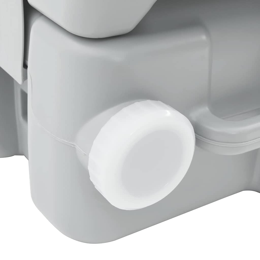 Detail van de T-type spoeldop van het vidaXL campingtoilet in grijs en wit.