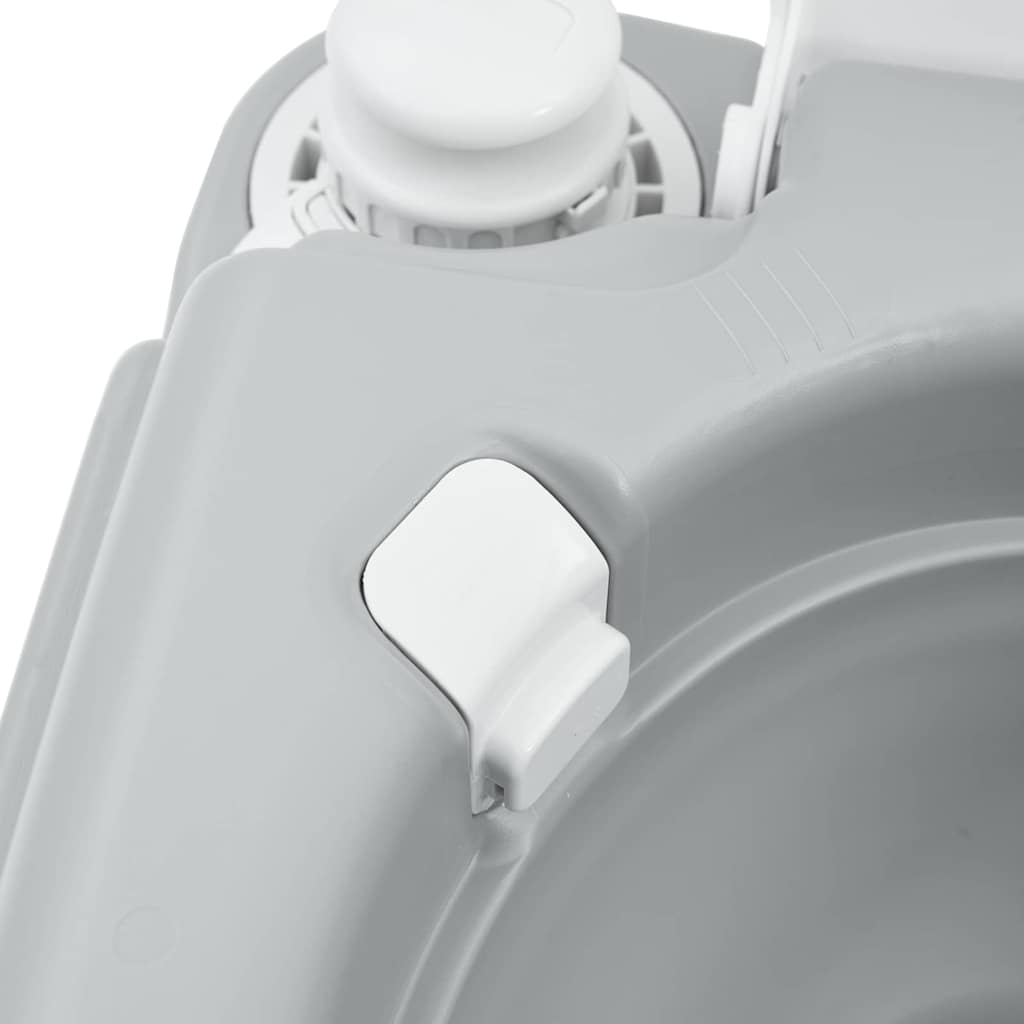 Detail van de spoelknop en het handvat van het vidaXL campingtoilet in grijs.