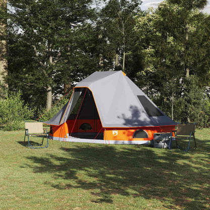 Grijze en oranje vidaXL Tipi Tent, weerbestendig, opgesteld in een groene omgeving.