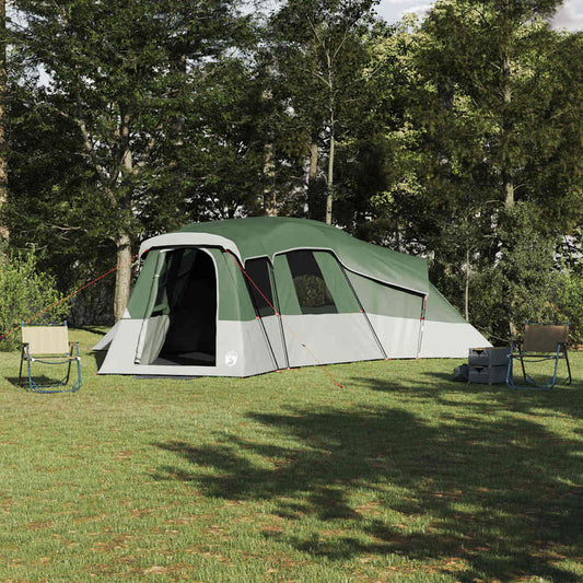 VidaXL gezinstent met dak in groen, geplaatst op gras met campingstoelen ernaast.