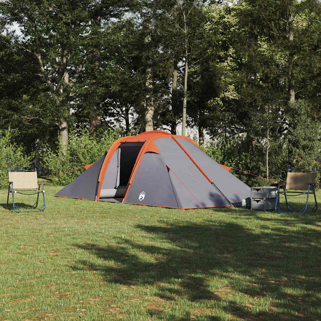 vidaXL Tunnel tent in grijs en oranje, opgesteld op gras met stoelen eromheen.