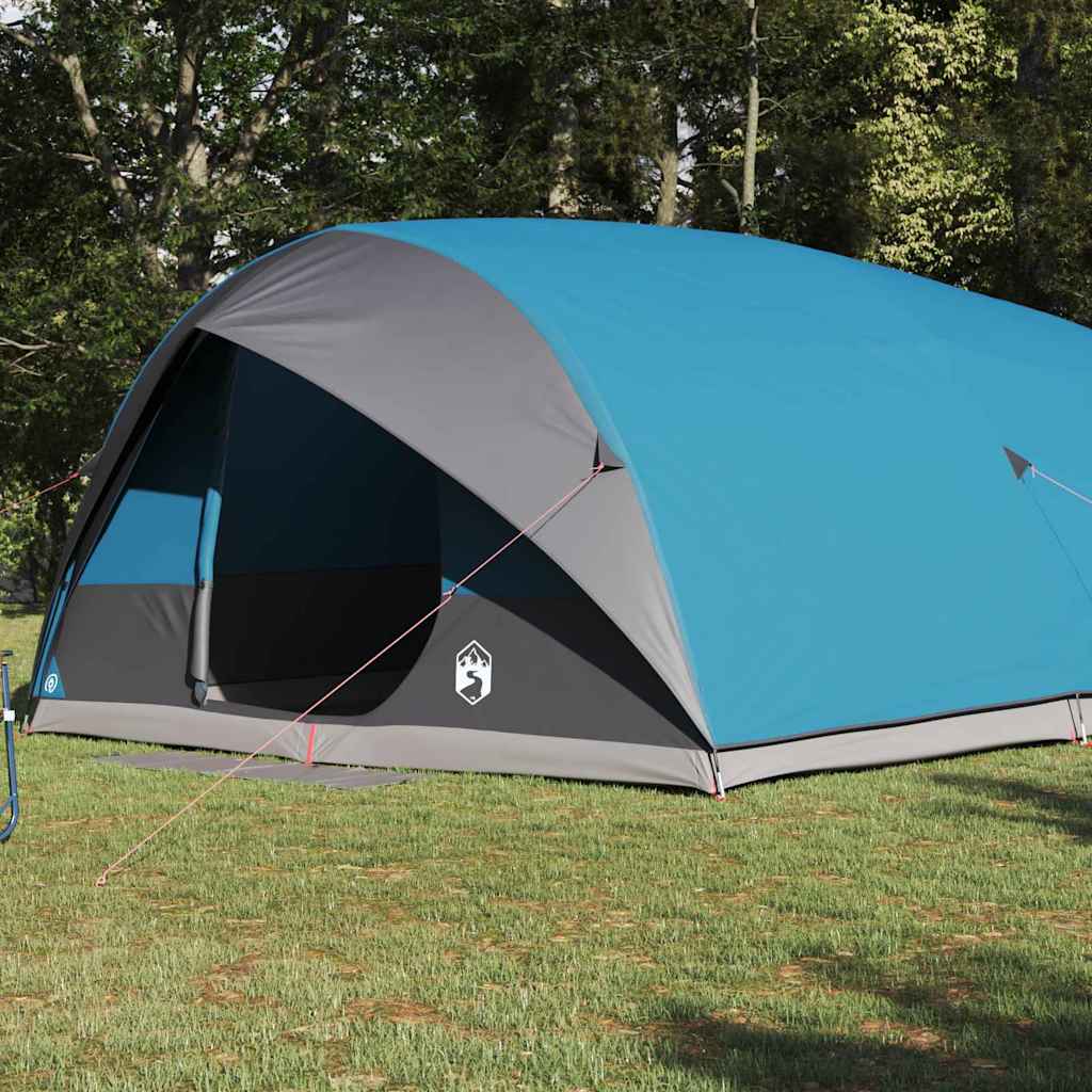 Zijaanzicht van de vidaXL Tunnel tent in blauw met grijze accenten, op gras.