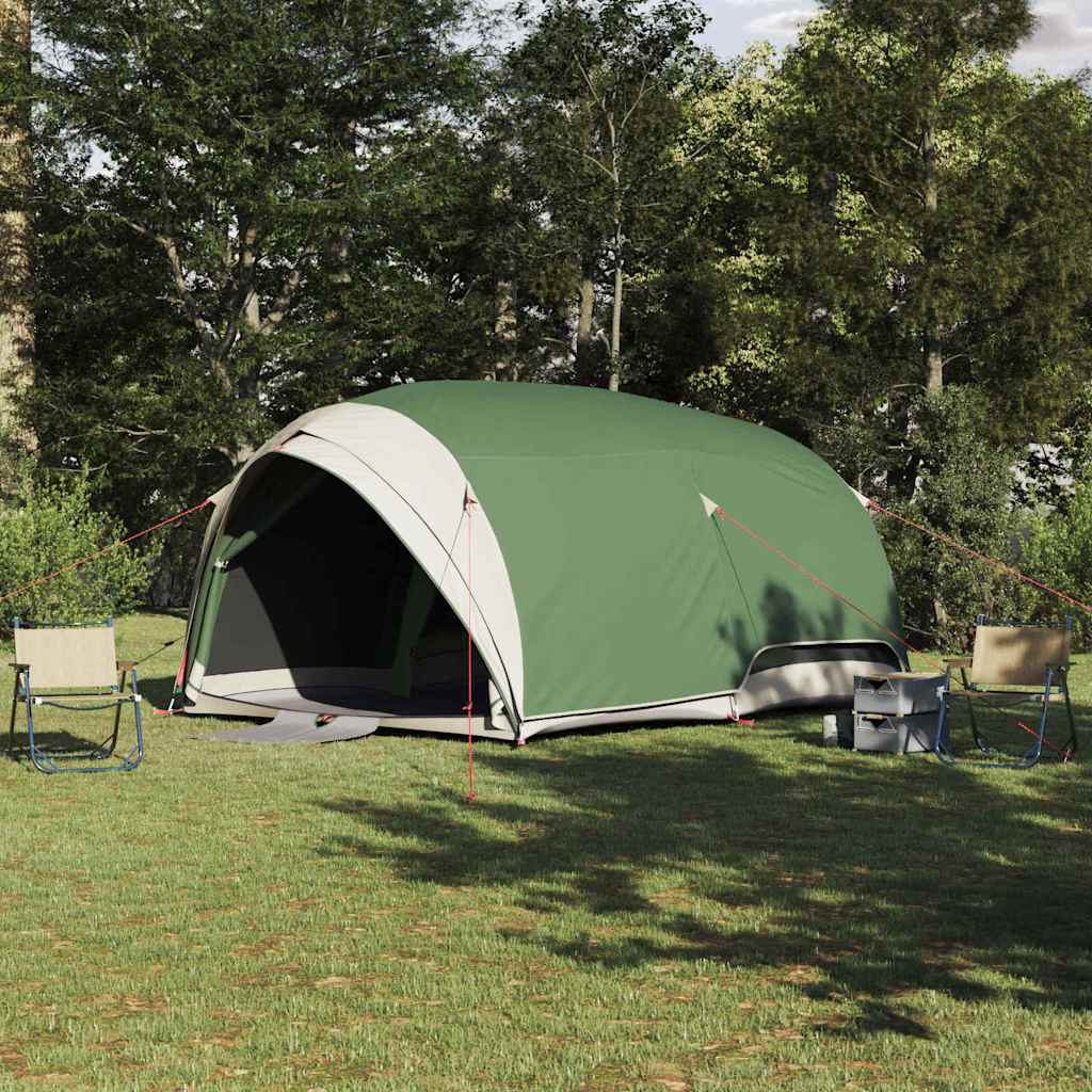 vidaXL Tunnel tent in groen met dak en opslag, geplaatst op gras tussen bomen.