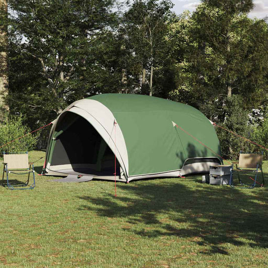 vidaXL Tunnel tent in groen met dak en opslag, geplaatst op gras tussen bomen.