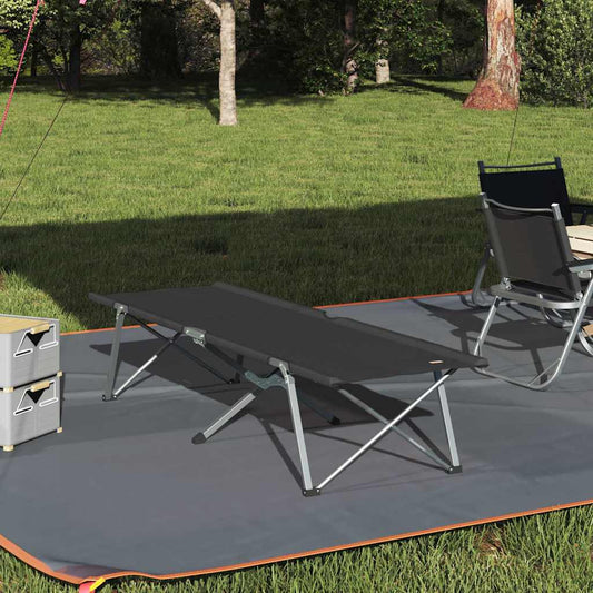Zwart vidaXL opvouwbaar campingbed op gras, ideaal voor buitengebruik.