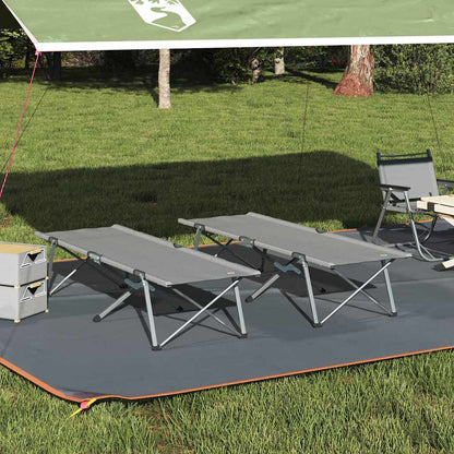 Opvouwbaar vidaXL campingbed in grijs, twee stuks, opgesteld op gras onder een luifel.