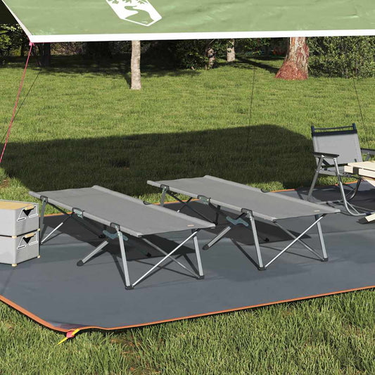 Opvouwbaar vidaXL campingbed in grijs, twee stuks, opgesteld op gras onder een luifel.