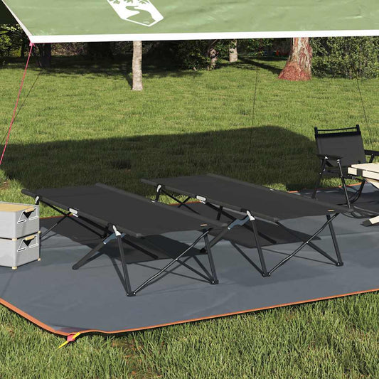 Zwart opvouwbaar campingbed van vidaXL, geplaatst onder een tentdoek op gras.