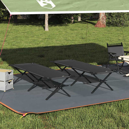 Zwart vidaXL opvouwbaar campingbed met stevig stalen frame, geplaatst op gras.