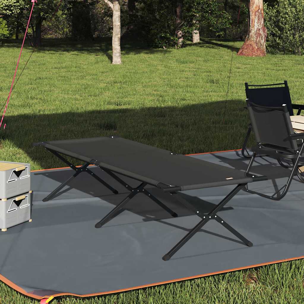 Opvouwbaar vidaXL campingbed in zwart, geplaatst op een groene grasmat.