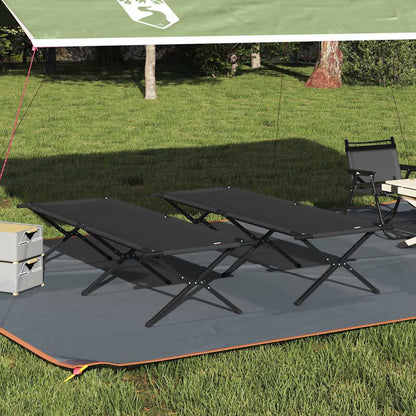 Opvouwbaar vidaXL camping bed in zwart Oxford stof, geplaatst onder een tent.