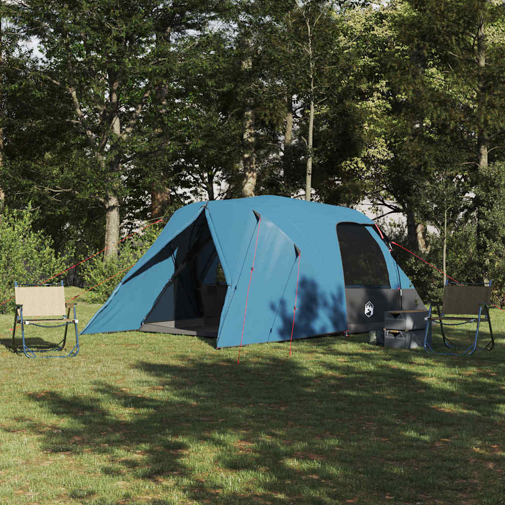 Blauwe vidaXL Dome Tent 4-Person in een groene omgeving met stoelen en een kampvuur.