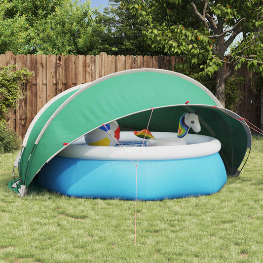 Blauwe vidaXL Pooldome met groene top, geplaatst boven een opblaasbaar zwembad in de tuin.