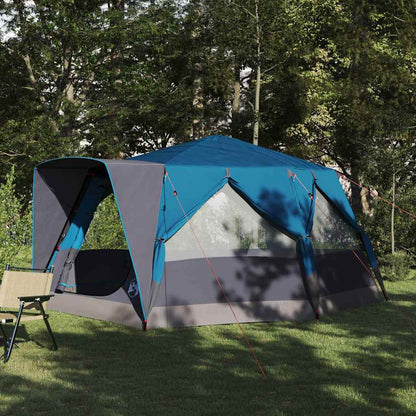 Blauwe vidaXL 7-persoons cabine tent met dak, opgesteld in een groene omgeving.