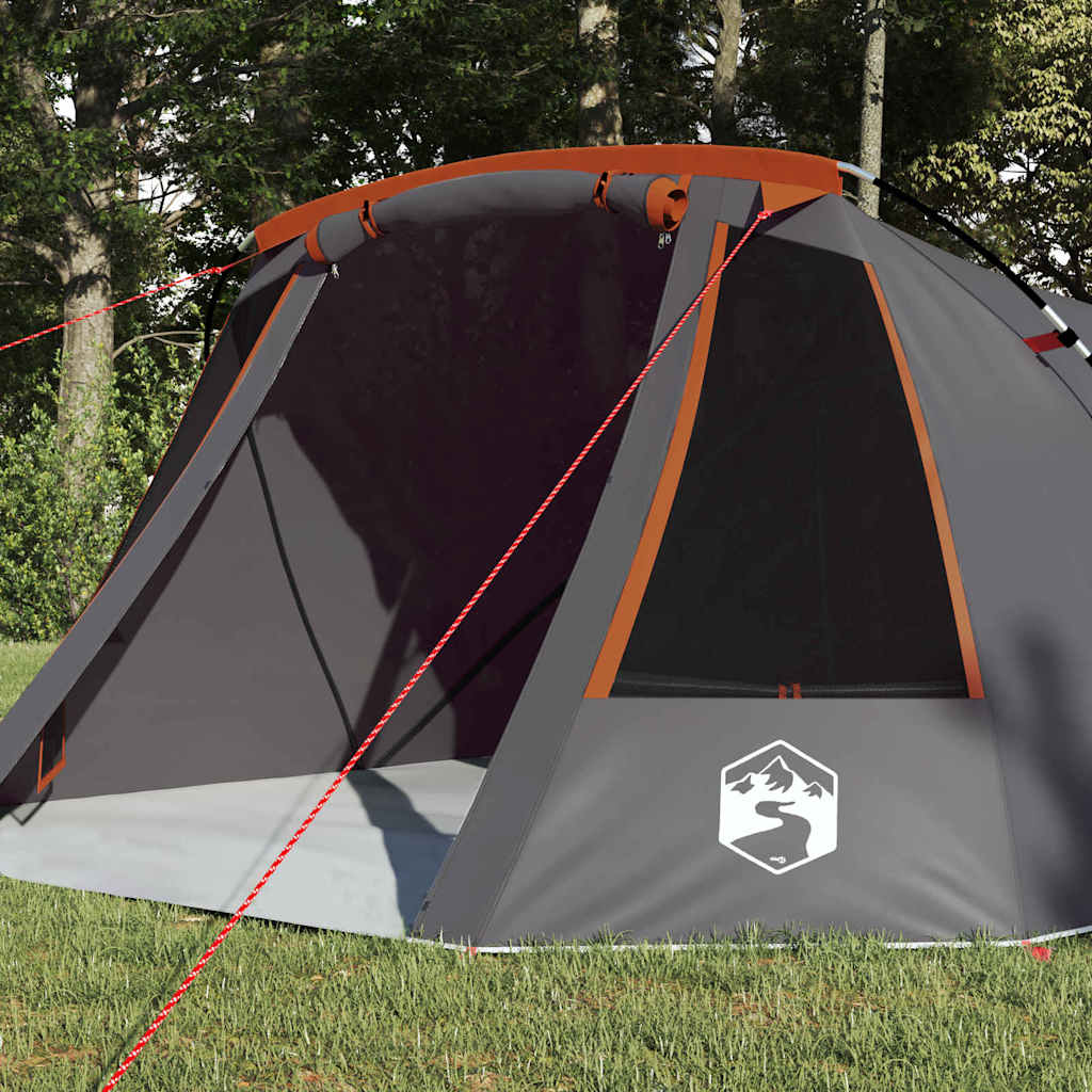 Zijaanzicht van de vidaXL Tunnel Tent met grijze en oranje details, in een groene omgeving.