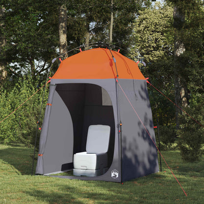 Detail van de vidaXL Instant Tent met grijs en oranje ontwerp, zijaanzicht met toiletstoel binnenin.
