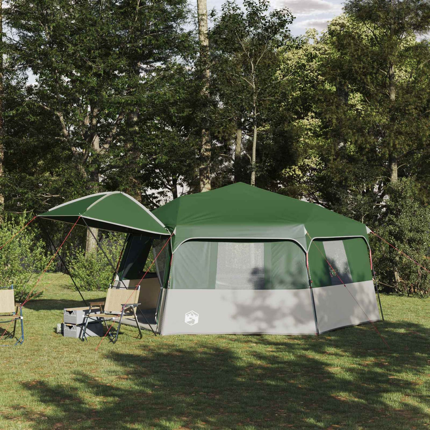Ruime vidaXL Instant tent voor 12 personen met groene regenhuif in een bosrijke omgeving.