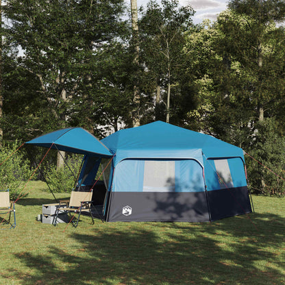 vidaXL Instant tent voor 12 personen in blauw met regenhuif, opgesteld in de natuur.