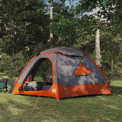 Grijze en oranje vidaXL koepeltent met verwijderbare regenkap in een bosrijke omgeving.